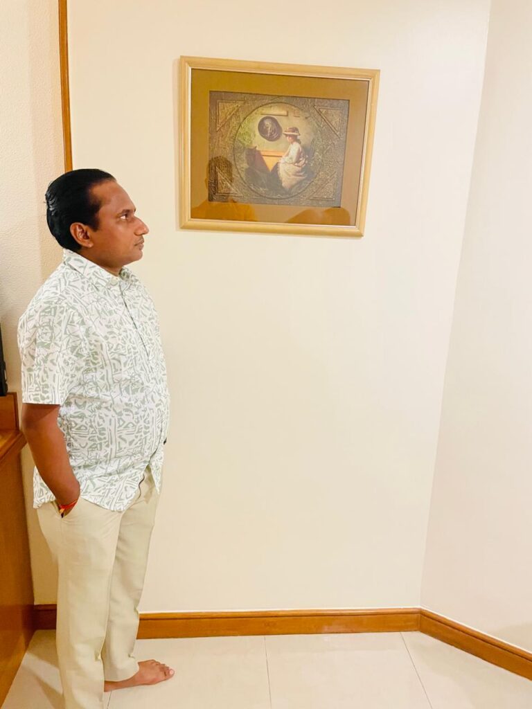 Sunil Prajapati looking at Painting