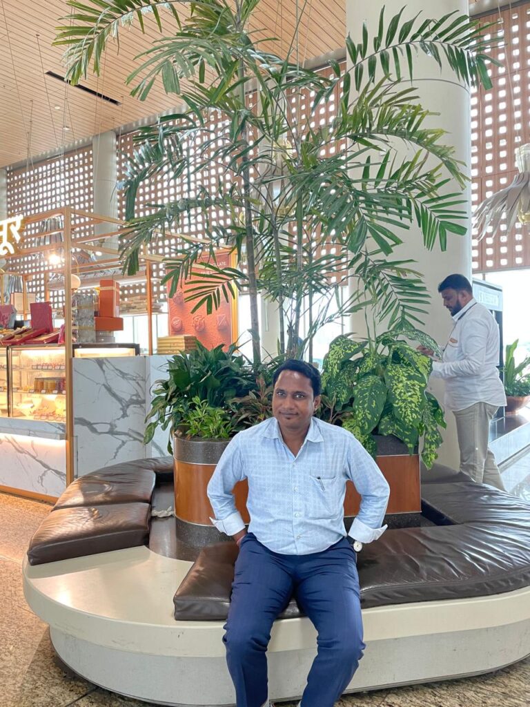 Sunil Prajapati sitting at Airport_SKP